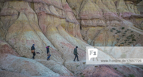 group of friend hiking at the Flaming cliffs in the Gobi desert