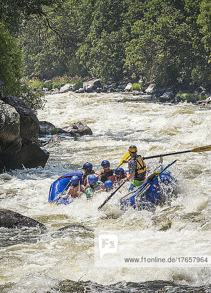 A raft rides into big whitewater.