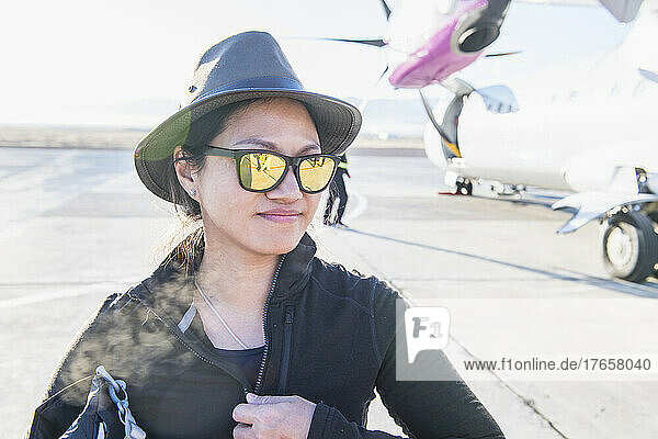 woman arriving by plane at small airfield in western Mongolia