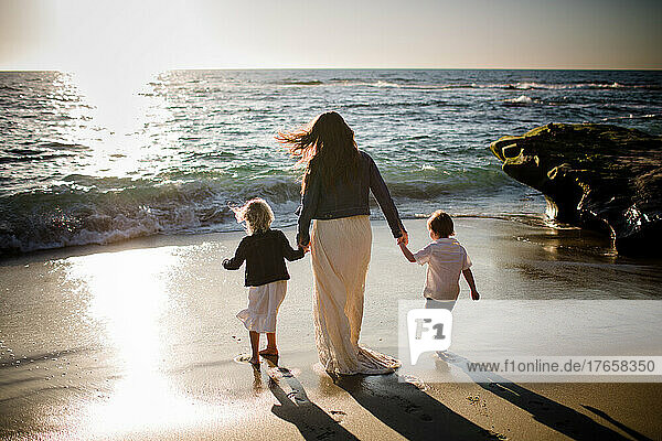 Mom Walking Along Beach with Young Children in San Diego