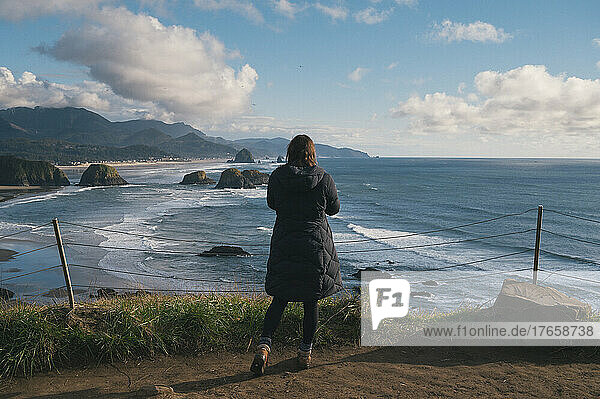 Female on a cliff above Cannon Beach on The Oregon Coast