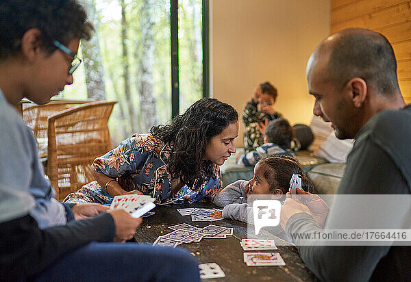 Family playing card game at home