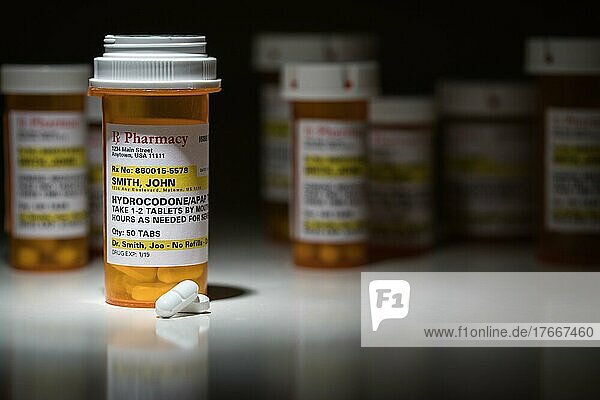 Hydrocodone pills and prescription bottles with non proprietary label. no model release required  contains fictitious information