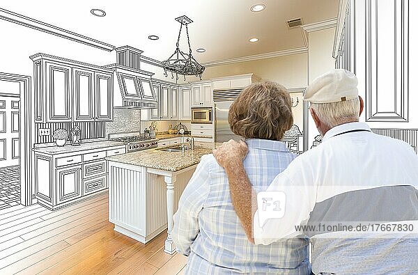 Senior couple looking over custom kitchen design drawing and photo combination