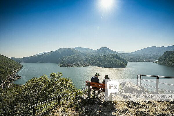 Viewpoint with couple on a bench  Sasso Delle Parole  near Lugano  Lake Lugano  Lago di Lugano  Ticino  Switzerland  Europe