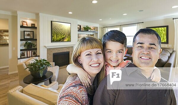 Happy young mixed-race family portrait in living room of home