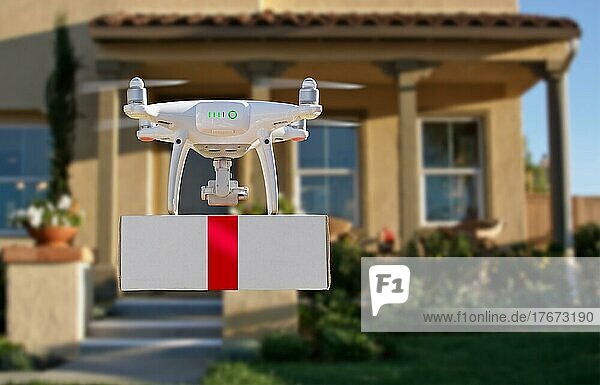 Unmanned aircraft system (UAV) quadcopter drone delivering box with red ribbon to home