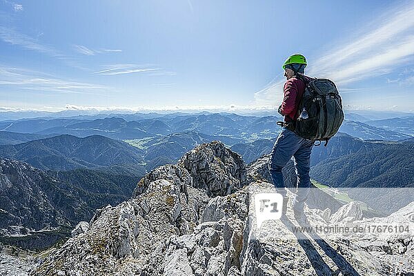 Hiker at the summit of Schaflegg  mountain panorama with rocky ridge and peak Seehorn  Nuaracher Höhenweg  Loferer Steinberge  Tyrol  Austria  Europe