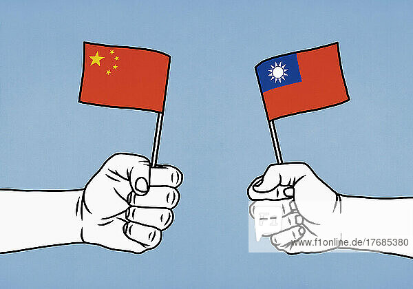 Hands holding flags of China and Taiwan