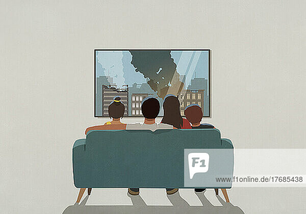 Family watching war bombing destruction on television news in living room at home
