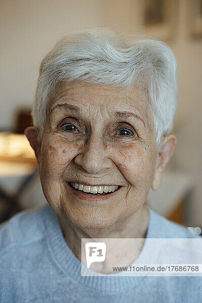 Happy senior woman with white hair