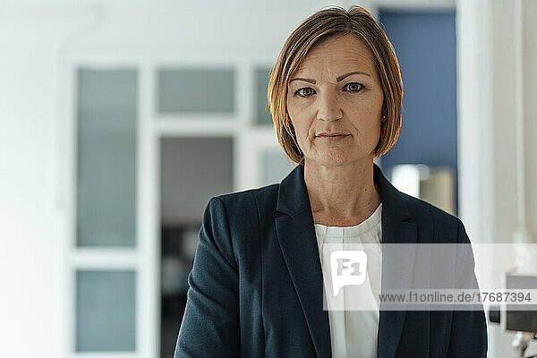 Businesswoman with short brown hair in office