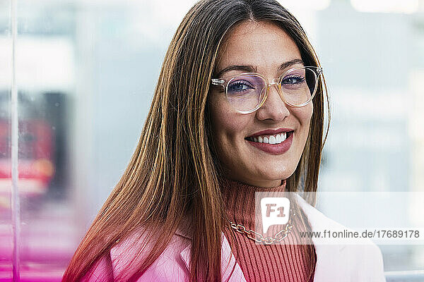 Smiling young woman wearing eyeglasses