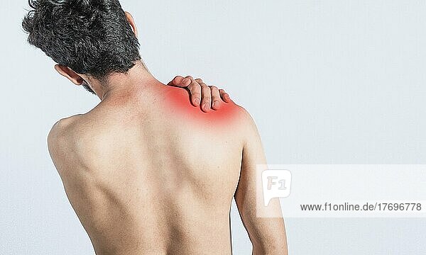Close up of man with neck pain  a man with neck pain on isolated background  neck pain and stress concept  man with muscle pain