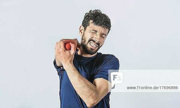 Man with elbow cramp  Person with elbow pain isolated  concept of a man with rheumatism elbow pain  man massaging sore elbow