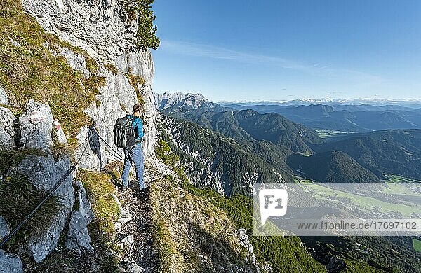 Hiker on hiking trail with steel cable  Nuaracher Höhenweg  Loferer Steinberge  Tyrol  Austria  Europe