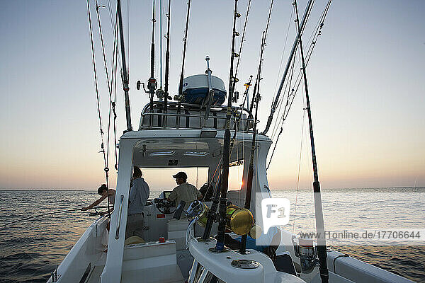 Fishing From A Boat At Sunset; Vamizi Island  Mozambique