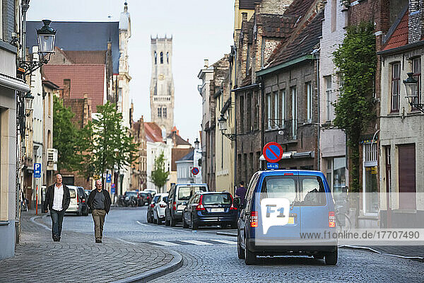 Camper van on road trip traveling through Old Town of Bruges; Vlaams Gewest  Belgium