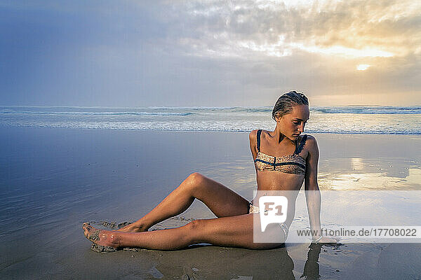 Young Woman In A Bikini On Tallows Beach At Sunrise; New South Wales  Australia