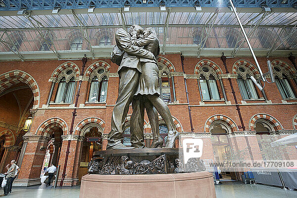 St. Pancras Railway Station And Statue Of Kissing Couple; London  England