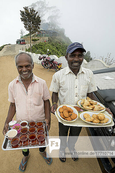 Tea and snacks being served at Lipton's Seat on Poonagala Hill  near the Dambatenne Tea Estate  Hill Country  Sri Lanka; Dambatenne  Badulla District  Sri Lanka