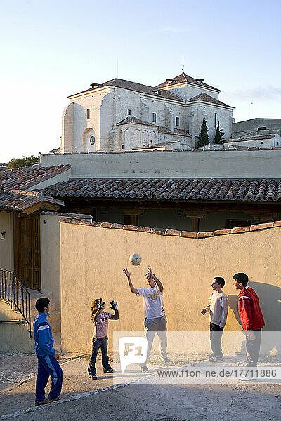 Kids Playing Football With The Church Of Chinchon In The Background In Chinchon  28 Miles South East Of Madrid  Spain