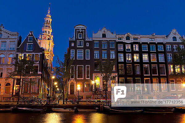 Gabled Houses At Dusk With The Spire Of The Zuiderkerk Church Behind; Amsterdam  Holland