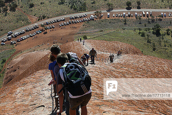 Tourists Walking Up Uluru  Formerly Known As Ayers Rock; Northern Territory  Australia