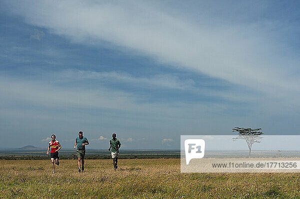 Guide And Tourists On Run Along Track With Mt Kenya Behind  Ol Pejeta Conservancy; Kenya