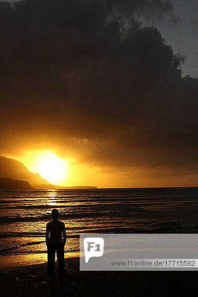 Woman Watching The Sunset Over Hanalei Bay  Kaua'i  Hawaii