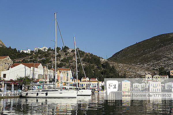 Sailboats moored in the harbor of the historical island of Kastellorizo (Megisti) Island; Dodecanese Island Group  Greece