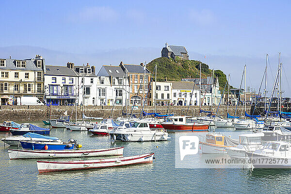 Ilfracombe harbour with yachts and St. Nicholas Chapel overlooking the town of Ilfracombe  Devon  England  United Kingdom  Europe