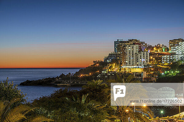 Hotels on the coastline at twilight  Funchal  Madeira island  Portugal  Atlantic  Europe