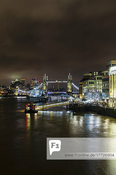 Tower Bridge and HMS Belfast on River Thames at night  London  England  United Kingdom  Europe