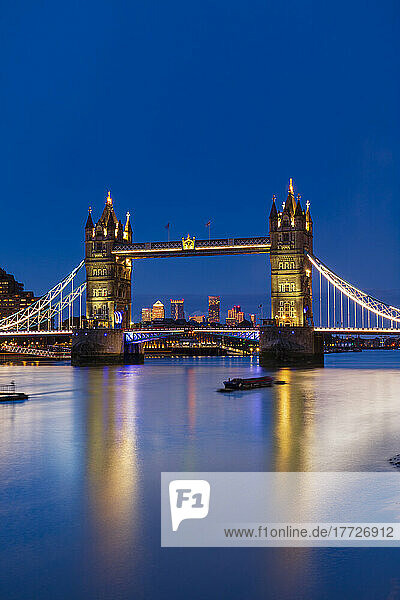 Tower Bridge at sunset with Canary Wharf skyline in background  London  England  United Kingdom  Europe