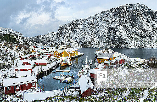 Panoramic of the fishing village of Nusfjord and harbor covered with snow in winter  Nordland  Lofoten Islands  Norway  Scandinavia  Europe