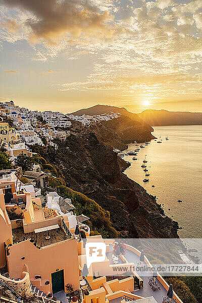 Sunrise over coastline of Oia  Santorini  Cyclades  Greek Islands  Greece  Europe