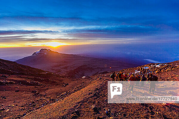 Hiking up Mount Kilimanjaro at sunset  UNESCO World Heritage Site  Tanzania  East Africa  Africa