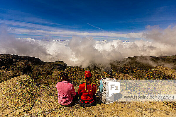 Women taking in the view on their way up Mount Kilimanjaro  UNESCO World Heritage Site  Tanzania  East Africa  Africa