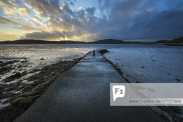 Pier at low tide at sunset  Rockcliffe  Dalbeattie  Dumfries and Galloway  Scotland  United Kingdom  Europe