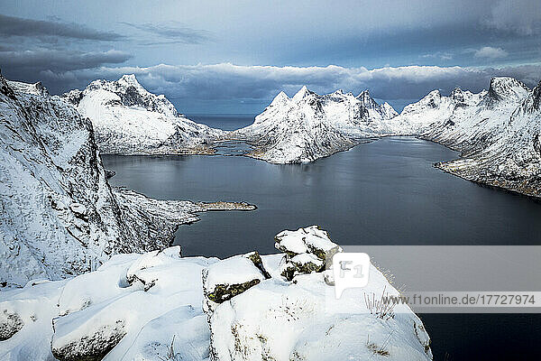 Aerial view of Reine Bay and mountains covered with snow in winter  Nordland  Lofoten Islands  Norway  Scandinavia  Europe