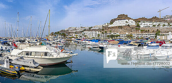View of harbour  boats and town  Playa de Puerto Rico  Gran Canaria  Canary Islands  Spain  Atlantic  Europe