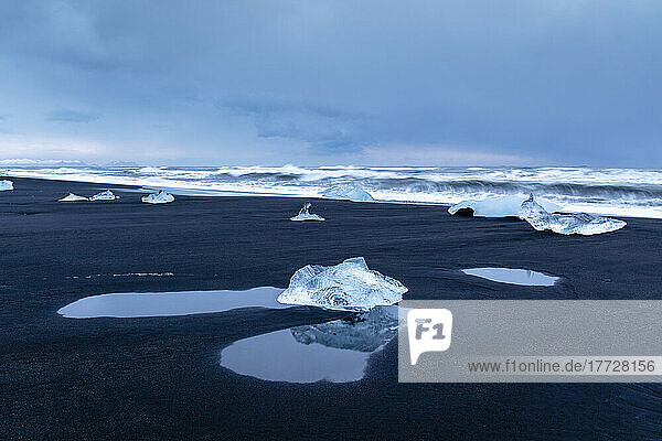 Icebergs from melting glacier on black sand beach near Jokulsarlon glacier lagoon  Vatnajokull National Park  Iceland  Polar Regions