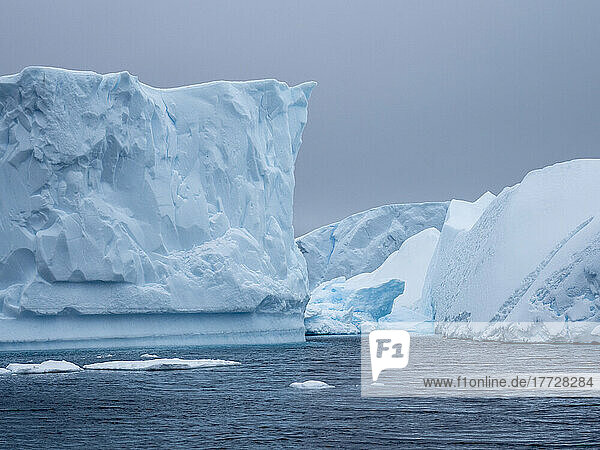 A huge iceberg grounded on a reef near the Iceberg Graveyard  Petermann Island  Antarctica  Polar Regions