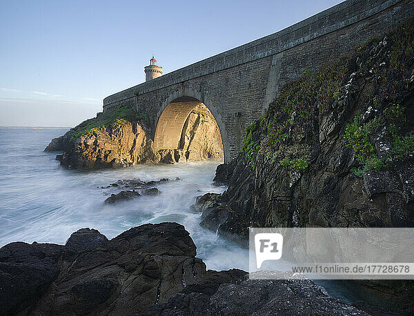 Cliffs and the bridge that lead to the Petit Minou lighthouse with side light at sunset  Finistere  Brittany  France  Europe