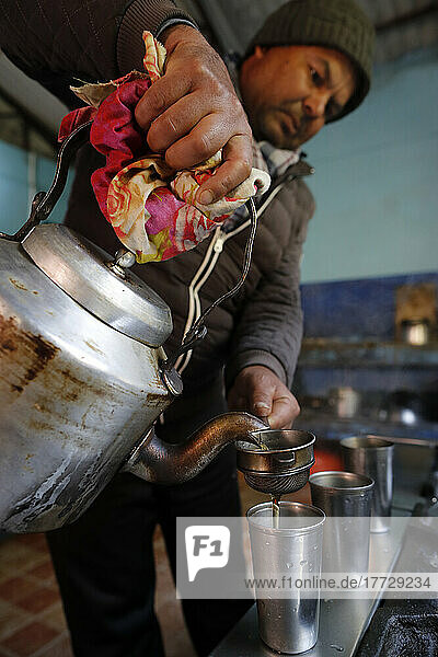 Pouring traditional Nepalese tea  Charikot  Nepal  Asia