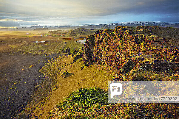 Cliff and mountain view from Dyrholaey Island  just before sunset  near Vik  south coast of Iceland  Polar Regions