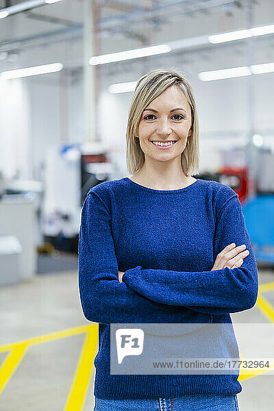 Portrait of smiling businesswoman in factory