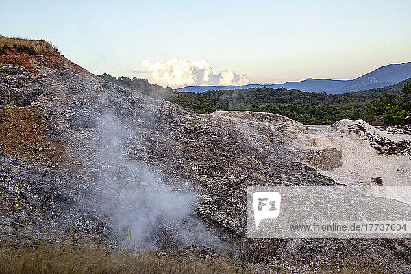 Scenic view of landscape with smoke at geothermal natural park Biancane at Monterotondo Marittimo  Grosseto  Italy