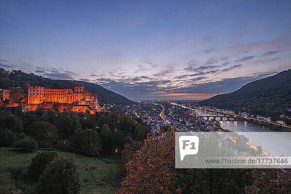 Germany  Baden-Wurttemberg  Heidelberg  View of Heidelberg Castle and surrounding town at dusk